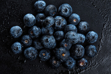 Fresh natural antioxidant blueberries pile, macro detailed close up