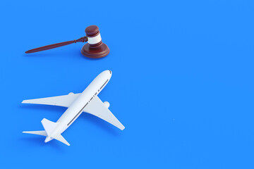 Passenger plane and judge gavel. Aviation law. Insurance, Obligations and responsibilities of airlines. Regulation rules. Licensing and legal work. Taxation of air transport. Copy space. 3d rendering