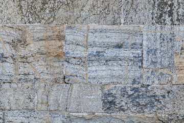 Fototapeta premium Ancient stone wall background closeup.