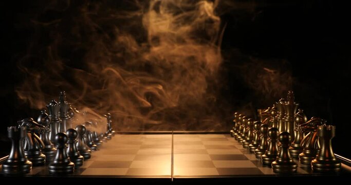 Board with chess pieces and smoke on dark background