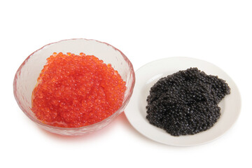 Red caviar lies in a glass bowl. Isolated object on a white background