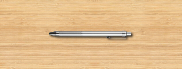 Metal pen isolated on wooden background