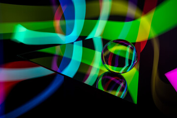 Glass crystal ball with a rgb multicolor pattern light painting fractals