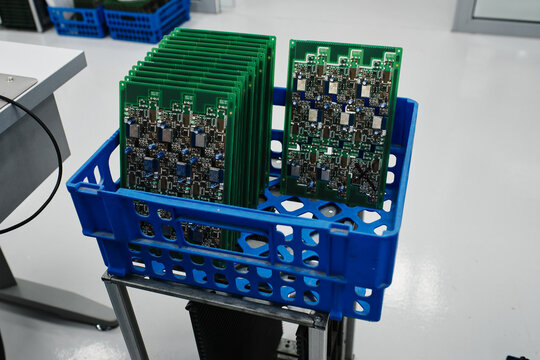 freshly made computer boards in a plastic box