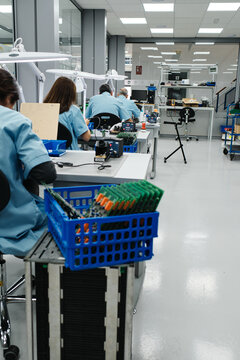 several workers make the products on their work table