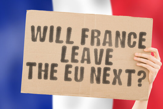 The question " Will France leave the EU next? " on a banner in men's hand with blurred French flag on the background. Separation. Divide. Split. Government. European Union. Brussels