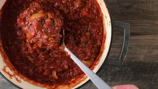 stirring big pot of bean-less chili top view