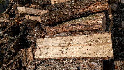 stack of firewood in winter. pile of wood logs