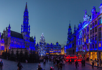 BRUSSELS, BELGIUM - DECEMBER 17, 2018: Evening view of the Grand Place (Grote Markt) with a christmas tree and illuminated buildings in Brussels, capital of Belgium