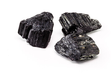 Brazilian black tourmaline, isolated over white background. Decorative esoteric crystal with mystical properties, protective stone.