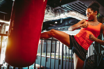 Young fit woman boxing workout in gym