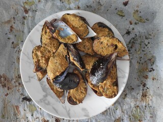 Mussels bowl on white baking paper