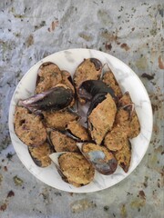 Mussels bowl on white baking paper