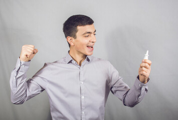 happily holding nose drops