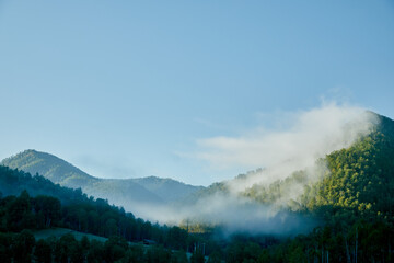 mountain sunrise in the morning with fog