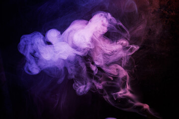 Abstract purple smoke moves on black background. Beautyful swirling smoke.