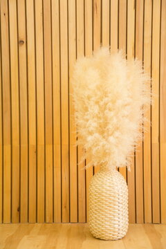 cotton flower in weave pot in wooden interior ,