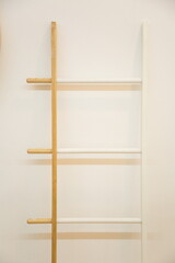 new design wooden staircase leaning against the white wall .