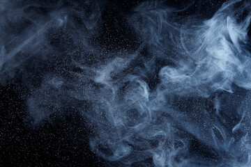 Abstract white smoke moves on black background. Beautiful swirling gray smoke.