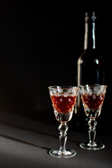 alcoholic drink in crystal glasses on a black background