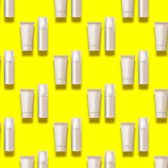 Grey plastic creams bottles seamless pattern. Cosmetics, skin care, beauty, body treatment concept. Creative design for packaging. Cosmetic tube, bottle on trendy yellow background. Flat lay. Mock-up