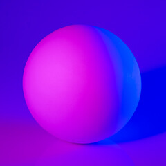 Gypsum sphere in pink and blue neon light