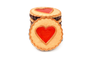 A stack of round cookies with a jelly red heart isolated on white