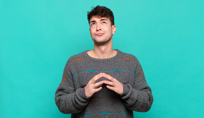 young man scheming and conspiring, thinking devious tricks and cheats, cunning and betraying