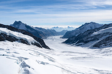 Amazing view of Aletsch Glacier, the largest glacier in the Alps, world heritage of Swiss and Bernese alps alpine snow mountains peaks, beautiful landscapes view downhill from the top of Jungfraujoch