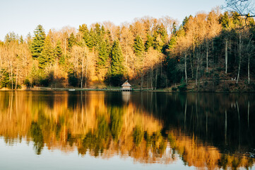Small wooden cabin on the lake in the forest. Trakoscan, Croatia is a lake near the famous castle Trakoscan.