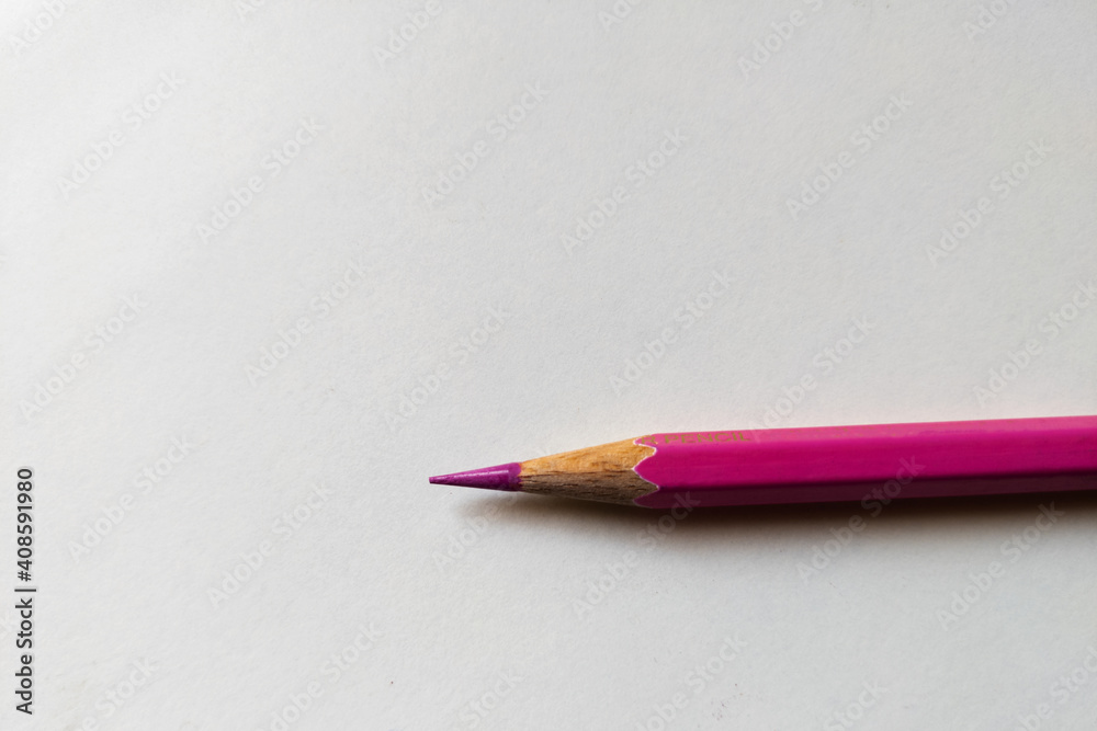 Poster Top view closeup of a colorful sharp pencil isolated on a white background