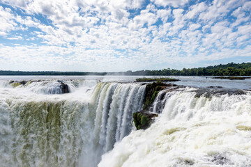 Closeup view of majestic powerful stream of Iguazu Falls