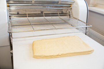 Fototapeta na wymiar raw puff pastry and dough sheeter