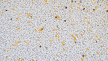Abstract background with bunch of white balls and a few yellow ones among them