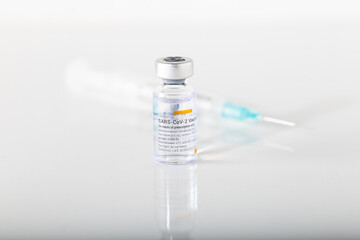 Izmir, Turkey -  01-26-2021: Sinovac Covid -19 vaccine vial and injection syringe isolated on white background.