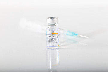 Izmir, Turkey -  01-26-2021: Sinovac Covid -19 vaccine vial and injection syringe isolated on white...