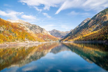 Water reflection of autumn mountain in Baserca reservoir, Spain