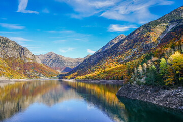 Baserca reservoir during Autumn under bright blue sky, Spain