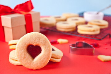 Heart shaped traditional linzer cookies with strawberry jam. Valentine s day concept.