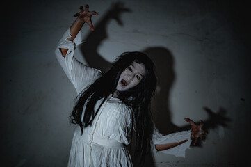 Portrait of asian woman make up ghost,Scary horror scene for background,Halloween festival...