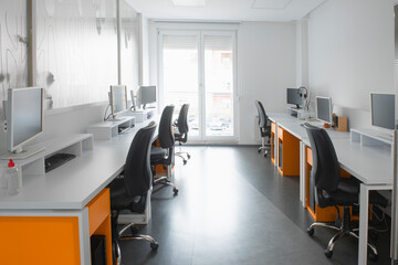 Modern workspace of a company with multiple computers for their employes