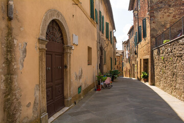 A quiet residential street in the historic centre of the medieval town of Monticiano in Siena Province, Tuscany, Italy

