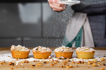 Mince pies being dusted with icing sugar © Barnaby