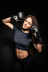 Fototapeta na wymiar girl boxer, boxing gloves on sports girl, womens boxing, athletic body