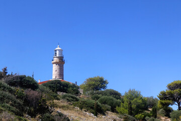 Fototapeta na wymiar Picturesque lighthouse on the hill. Beautiful landscape on island Lastovo, Croatia.