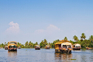 Houseboats on the backwaters of Kerala in Alappuzha (Alleppey) in India. A traditional tourist attraction is the house-boat on the river channels of Kerala.