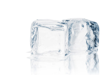 Melting natural crystal clear ice cubes on a white reflective surface.	