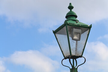 Fototapeta na wymiar Beautiful antique luminous green street lantern at former Newcastle Railway Station, Sea Road, Leamore Upper, Arklow, Co. Wicklow, Ireland