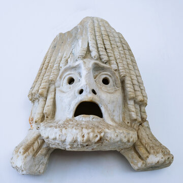 Ancient Greek theater tragedy mask on a white backround