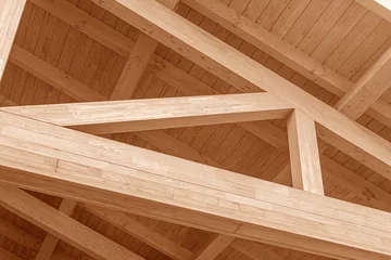Foto auf Leinwand Wooden roof structure. Glued laminated timber roof. Rafters made of wood. © Denis Rozhnovsky